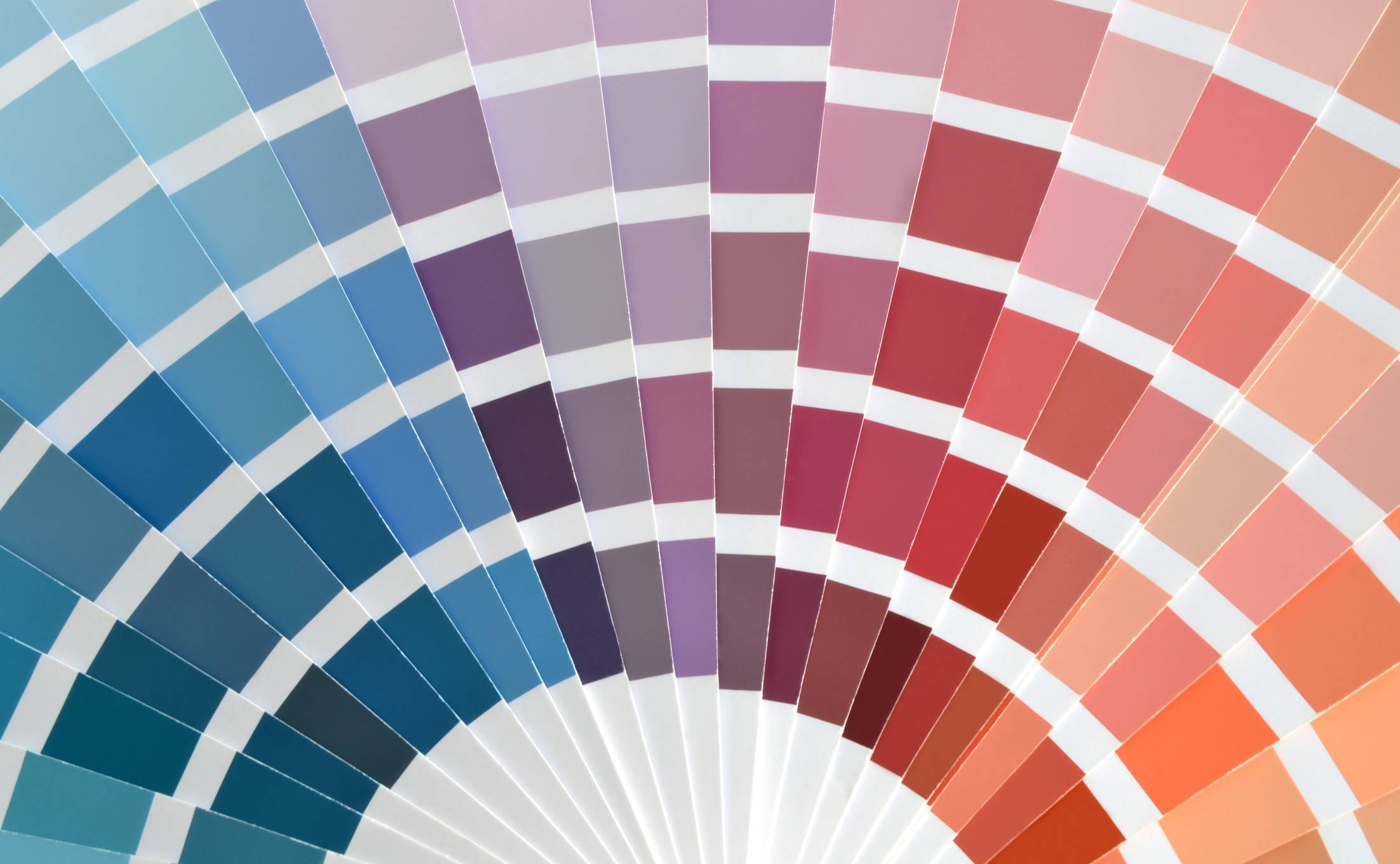 Color matching systems often involve booklets of color samples like these