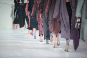 A low angle of runway models walking away from the camera