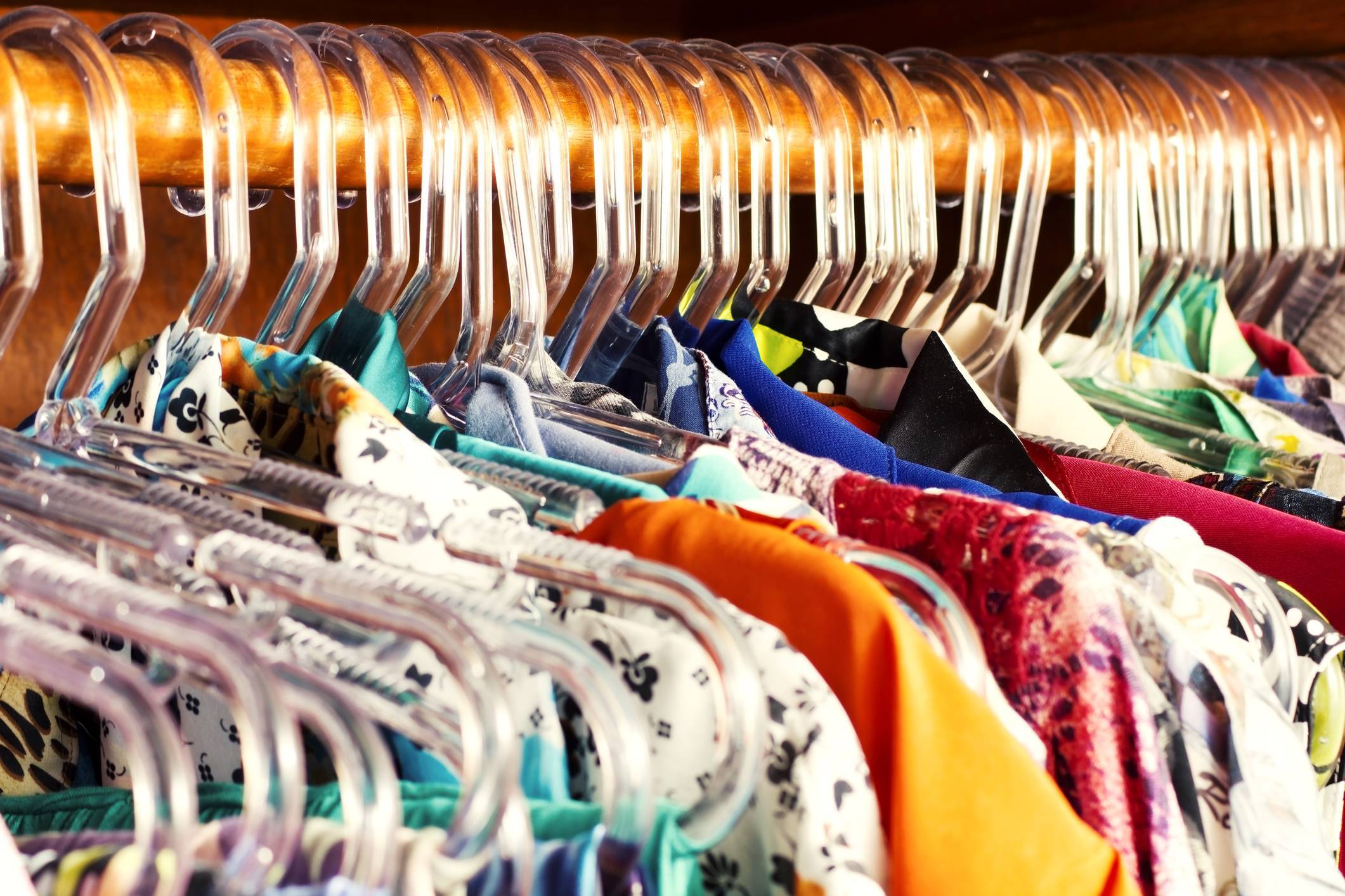 multiple colors of clothes on hangers