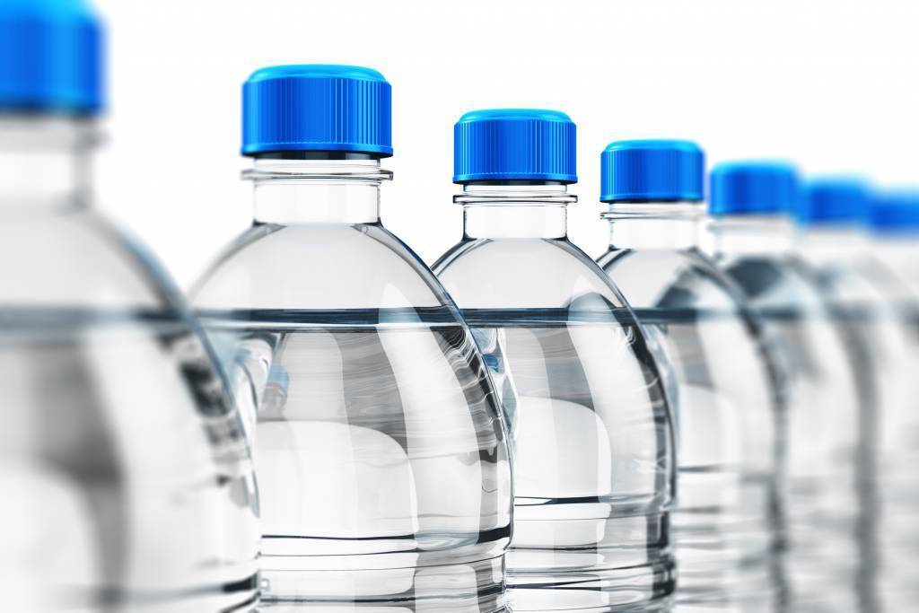 plastic water bottles on a production line before coding