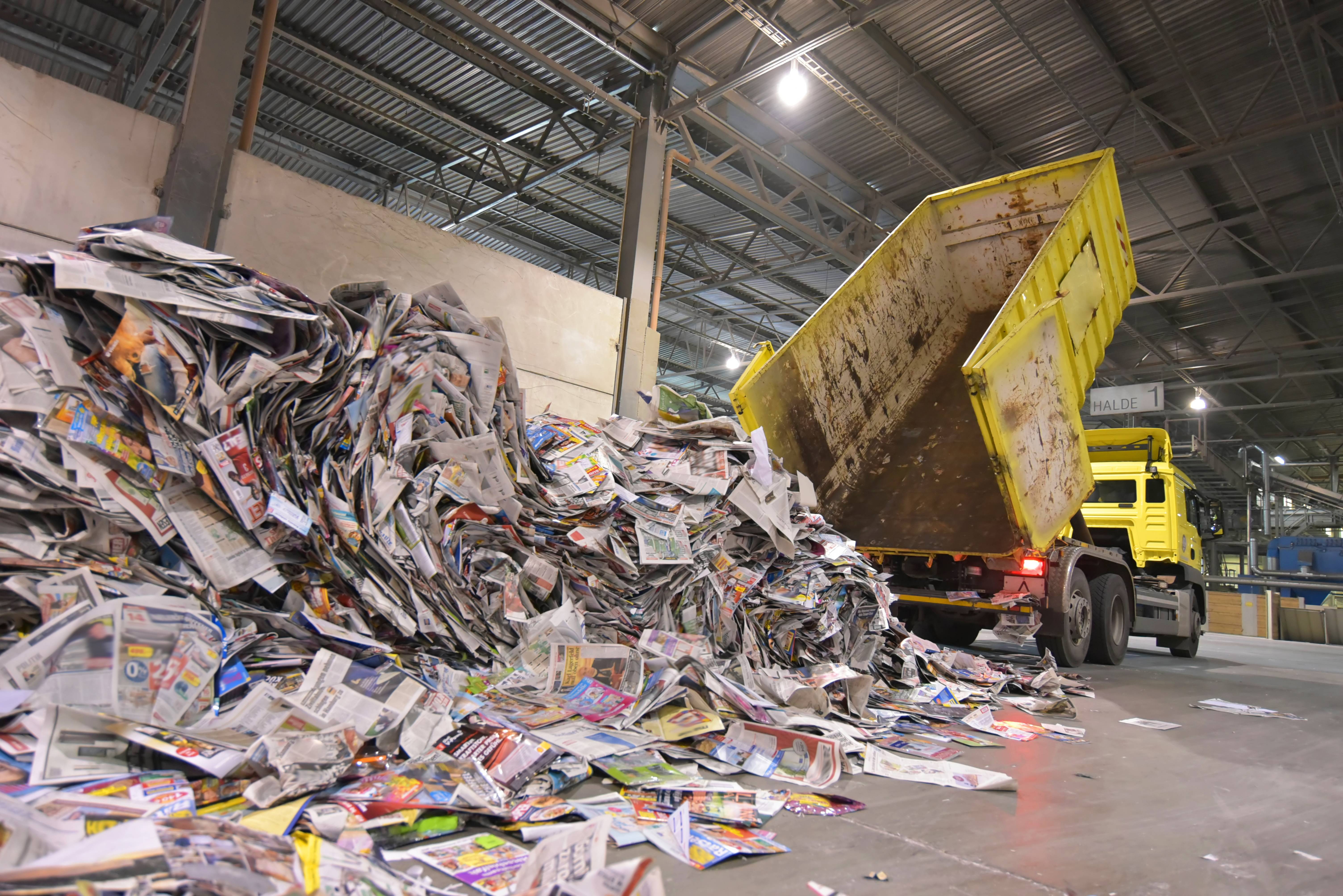 Truck dumps paper for recycling