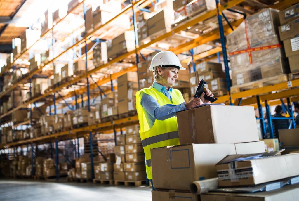 photo of woman warehouse worker checking inventory