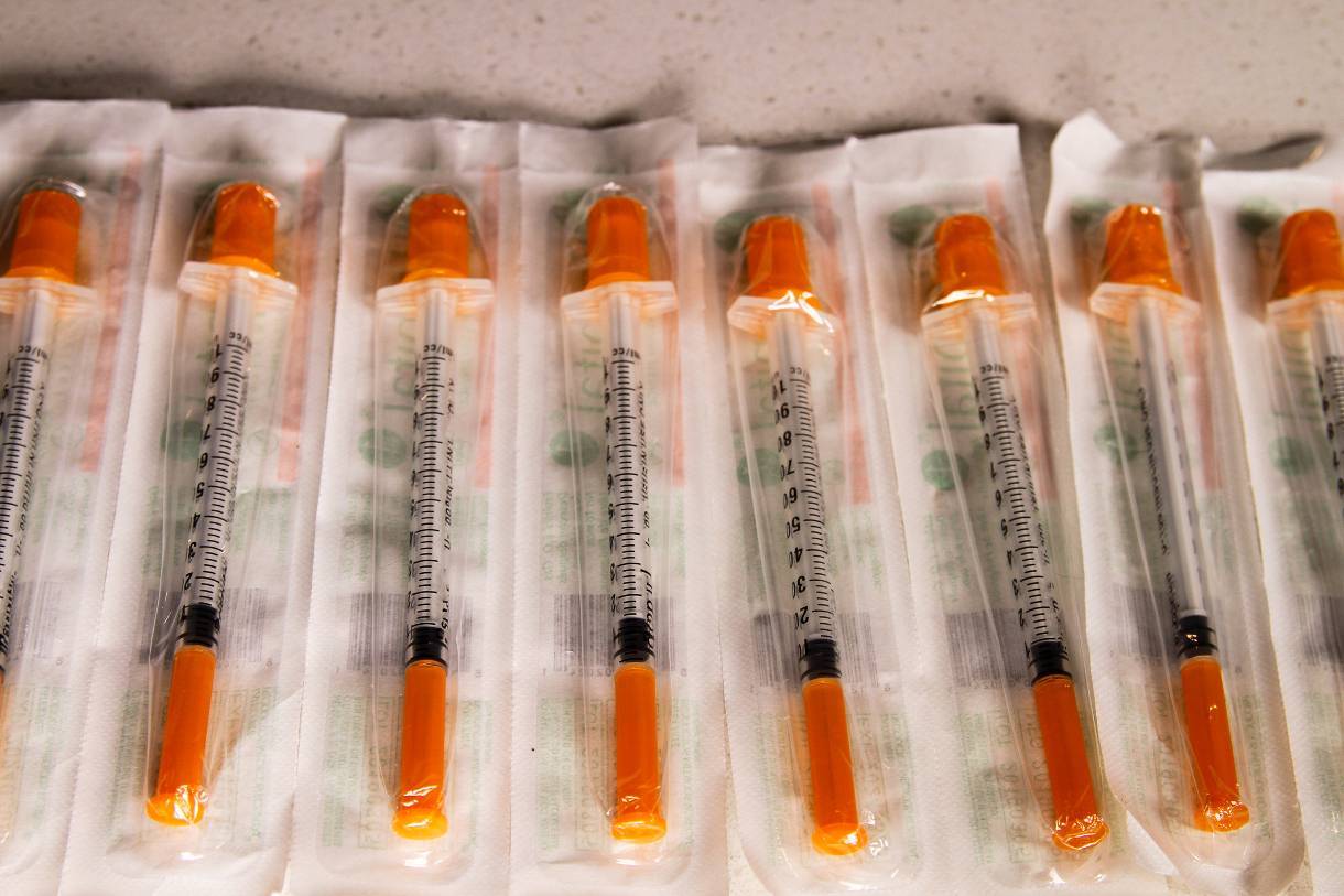 Packaged orange-tipped syringes