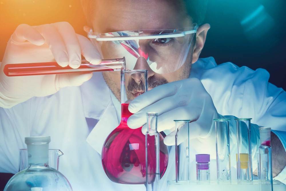 Chemist in lab formulating ink.