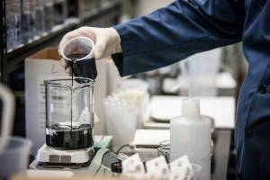 Pouring inkjet ink in Kao Collins lab